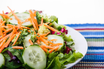 Fresh Vegetable Salad on Colorful Placemat