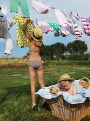 young girl hanging linen