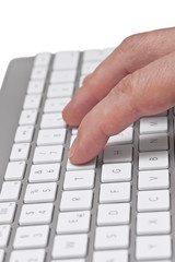 hand typing on laptop, close-up