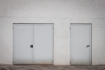External shut doors on a white wall