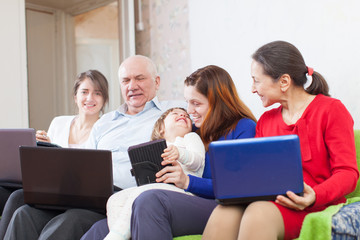 family with laptops