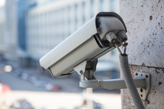 Video surveillance camera on a wall of the building
