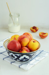 Ripe nectarines in oriental bowl