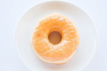 Classic donut serving on white dish