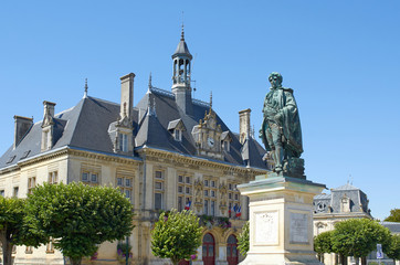 City Hall of St Jean d'Angely with statue of Regnaud , France