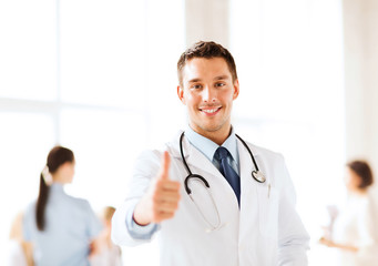 Fototapeta premium doctor with stethoscope showing thumbs up