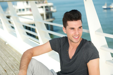 Handsome young man relaxing outdoors on a summer day