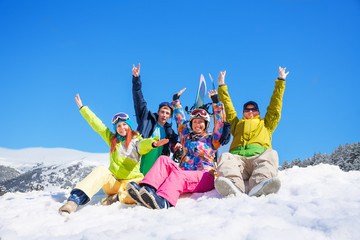 Group of four snowboarders