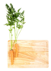 Carrots on wooden board isolated on white