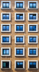 Fototapeta premium Window Pattern on a Brown Facade