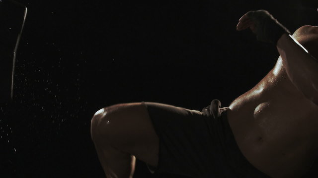 Kickboxer shadow boxing as exercise for the big fight