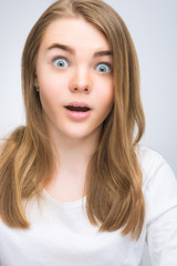 Fototapeta premium portrait of surprised teenage girl isoalted