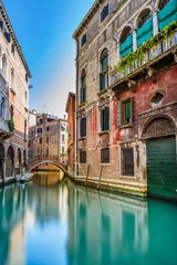 Tuinposter Venice cityscape, water canal, bridge and buildings. Italy © stevanzz