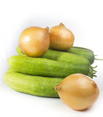 Fresh green cucumbers on white