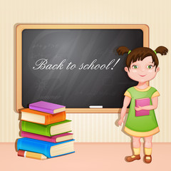 Cute girl with book at the board