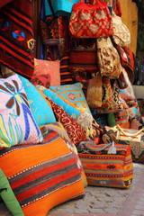 Fototapeta na wymiar Fabrics, textiles and turkish rugs at a bazaar in Turkey