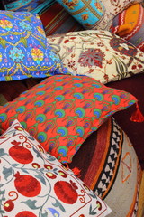 Fabrics, textiles and turkish rugs at a bazaar in Turkey