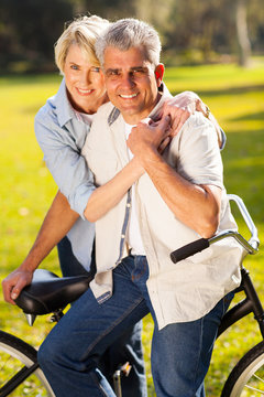 mature couple with a bicycle