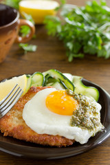 Wiener schnitzel with fried egg and capers.