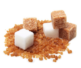 Brown and white cane sugar cubes isolated.