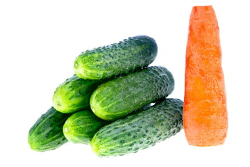 ripe cucumbers and carrots on a white background