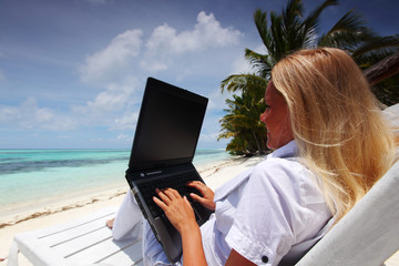tropical business woman with laptop
