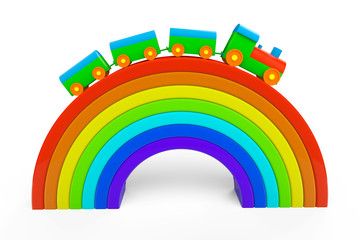 Toy multicolor train over rainbow bridge