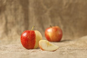 Tasty red apples on table