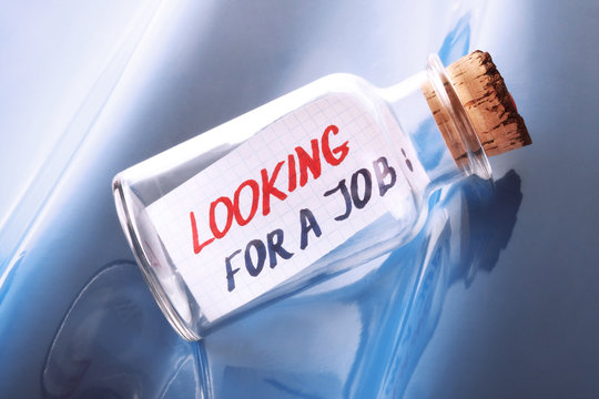 concept of a bottle with a message "Looking for a job"
