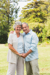 Obraz premium Smiling mature couple in park