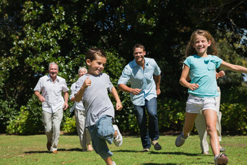 Happy multi generation family racing towards camera