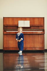little funny boy plays piano