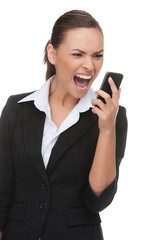 Businessman on the phone. Angry young businessman shouting on th