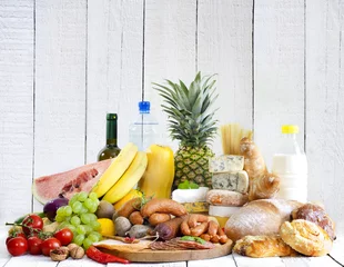 Foto op Plexiglas Variety of grocery products fruits meat cheese and bread © udra11