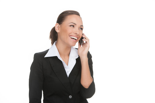 Businessman on the phone. Cheerful young businessman talking on