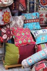 Fototapeta na wymiar Fabrics, textiles,bags and turkish rugs at a bazaar in Turkey
