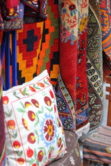 Fabrics, textiles,bags and turkish rugs at a bazaar in Turkey