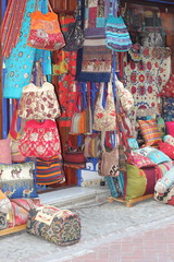 Fabrics, textiles,bags and turkish rugs at a bazaar in Turkey