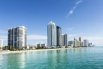 beautiful beach with condominiums and skyscraper in Sunny Island