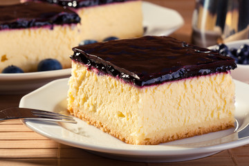 Cheesecake with blueberries and a cap of coffee