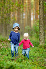 Fototapeta premium Two adorable little sisters hiking