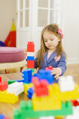 Little girl playing in the room