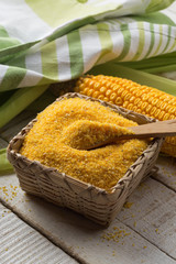 Obraz premium Corn meal on wooden background