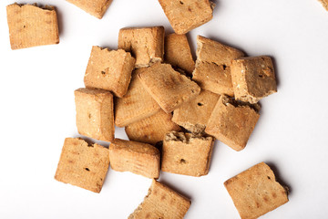 Pile of dog treats against a white background
