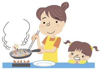 料理を作るお母さん見守る子供