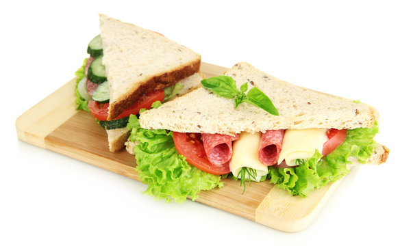 Tasty sandwiches with salami sausage and vegetables