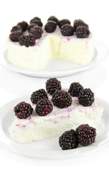 Cheesecake with fresh berries on white plate closeup