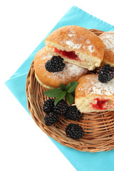 Tasty donuts with berries, isolated on white