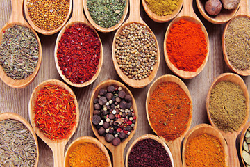 Assortment of spices in wooden spoons close-up
