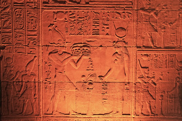 Ancient hieroglyphics on the wall of Philae Temple